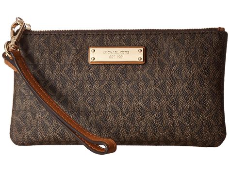 brown michael kors wristlet.